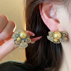 Vintage style floral stud earrings with pearls and sparkling crystals in gold finish