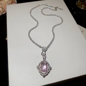 Exquisite detail of a vintage pink gemstone pendant necklace with zirconia tennis chain