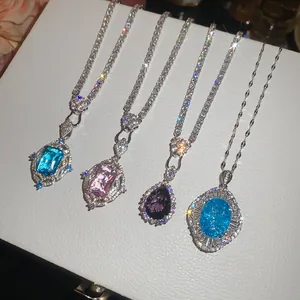 Detailed view of four shimmering zircon pendant necklaces with elegant colored gemstones.