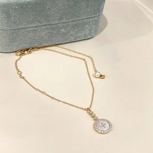Elegant 18k gold plated round necklace with zircon and pearl details