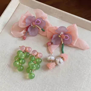 Elegant handmade chiffon flower and green glass bead cluster earrings for a sweet look