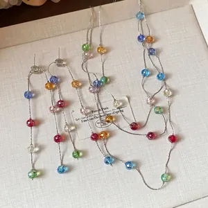 Exquisite colorful glass bead tassel jewelry set featuring a necklace and drop earrings