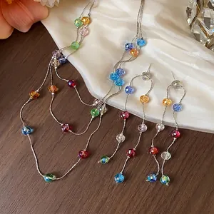 Elegant jewelry set featuring multi-colored glass beads on delicate thin silver chains.