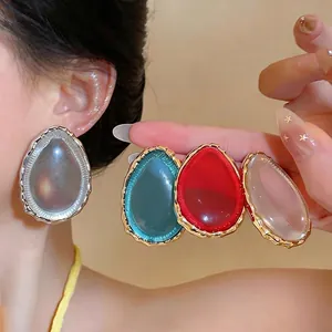 Oversized teardrop resin earrings with wavy gold borders in multiple colors