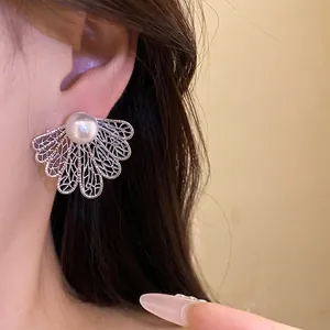 Vintage court style silver needle stud earrings with white pearl and hollow leaf design