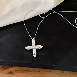 Detailed view of elegant silver cross star pendant necklace with sparkling zircon center