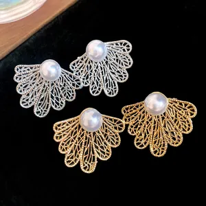Elegant hollow leaf earrings with pearls in gold and silver finish, retro jewelry style