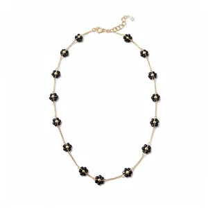 Collana vintage con fiori di cristallo nero e catena d'oro regolabile con perla