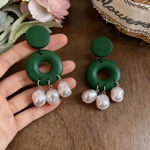 Elegant vintage green geometric hoop earrings featuring three baroque pearl drops