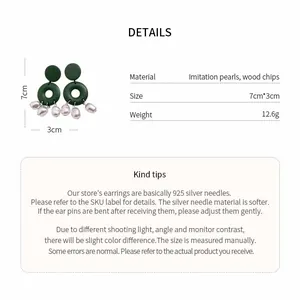 Detail page for green geometric earrings with pearls, 925 silver needle info, size 7x3cm.