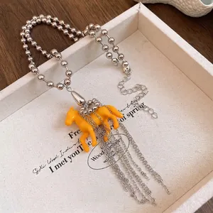 Stylish resin horse pendant necklace with silver beaded chain and elegant tassels