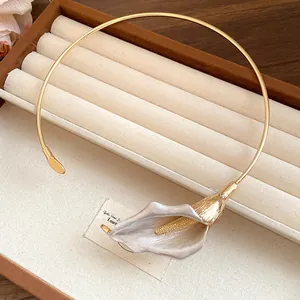 Detailed view of elegant vintage gold metal Calla Lily flower choker collar necklace