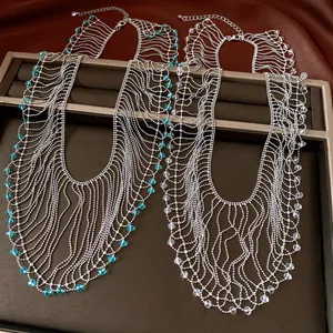 Detailed macro shot of vintage crystal bead tassel necklaces in blue and clear beads