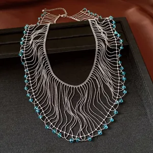 Close-up detail of vintage-style fringe necklace with light blue crystal beads