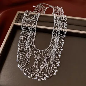 Detailed shot of a vintage silver beaded fringe necklace with clear crystal drops.