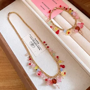 Elegante set van roestvrijstalen ketting en armband met kleurrijke harsbloembedeltjes