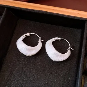 Brushed silver-tone hoop earrings with a minimalist 18K gold plated finish