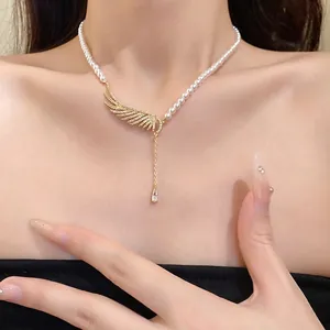 Elegant zircon and pearl wing necklace with a delicate water drop pendant