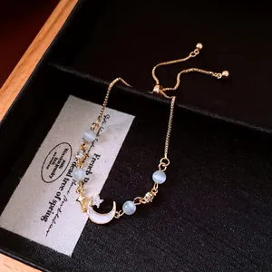 Elegant French vintage cat's eye and zircon moon adjustable bracelet in gold finish.