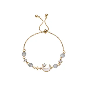 Elegant French vintage gold moon bracelet with cat-eye stones and shiny zircons.