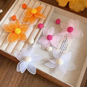 Elegant mesh flower earrings in vibrant pink, orange, and white dopamine styles.