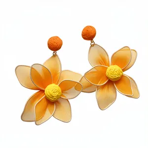 Oversized yellow mesh flower earrings with orange fabric studs for a vibrant dopamine look