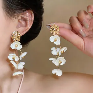 White acrylic flower petal tassel earrings with gold alloy studs for sweet holiday style