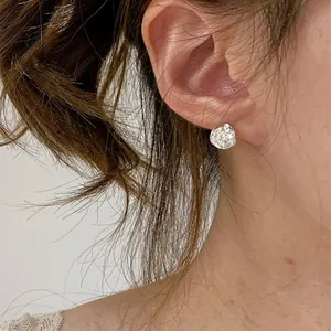 Elegant irregular silver stud earrings with sparkling cubic zirconia stones for women