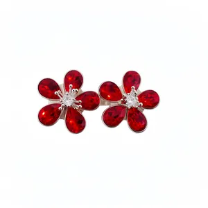 Elegant silver needle flower stud earrings with vibrant red crystals and diamond accents