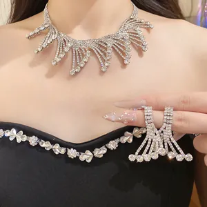 Elegant close-up of sparkling rhinestone necklace and matching earrings set with fringe design