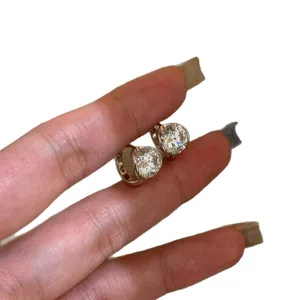 Minimalist silver-tone earrings featuring sparkling round brilliant-cut cubic zirconia stones