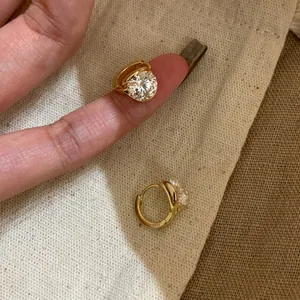 Detailed view of elegant gold hoop earrings with sparkling round cubic zirconia stones
