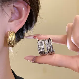 Textured C-shaped hoop earrings with silver needle in gold and silver finish for women