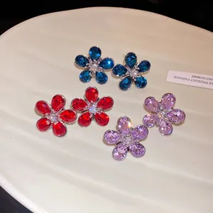 Detailed view of elegant flower stud earrings with sparkling colorful rhinestones