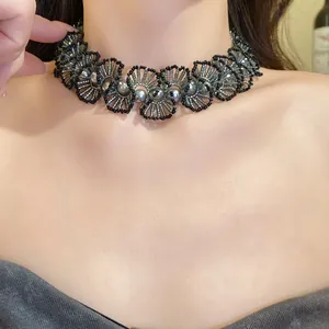 Close-up view of a handmade pearl beaded lace choker necklace worn by an Asian model