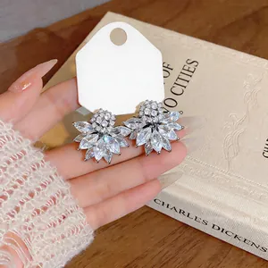 Close-up detail of vintage French flower earrings with sparkling clear crystals