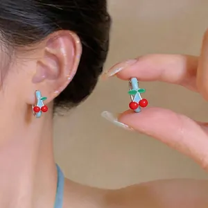 Cute cherry drip oil hoop earrings featuring red fruit and green leaf design details