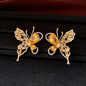 Elegant 18K gold plated butterfly stud earrings with yellow zircon crystals