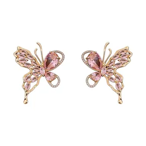 Elegant 18K gold-plated butterfly stud earrings with pink crystals and zircon accents.