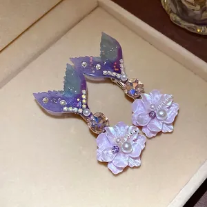 Sparkling rhinestone pearl mermaid tail flower hair clips in a jewelry box