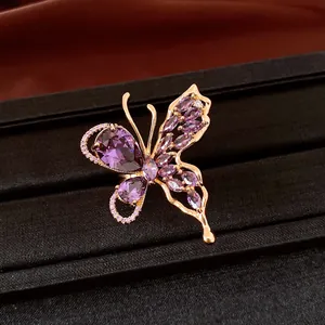 Detailed view of elegant butterfly earring featuring purple zircons and 18K gold plating finish