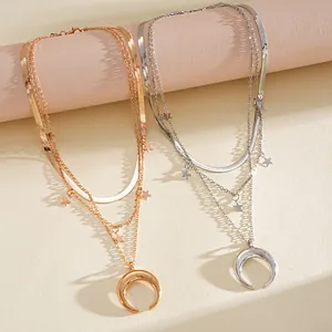 Detailed macro shot of elegant gold and silver multi-layer moon and star pendant necklaces