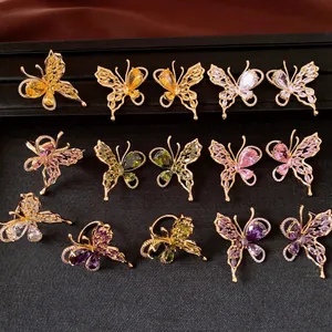 Collection of 18K gold plated butterfly stud earrings with colorful cubic zirconia