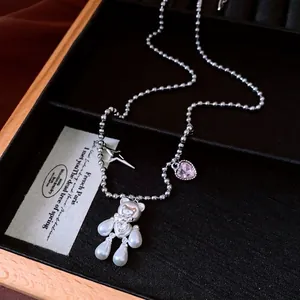 Elegant pearl teddy bear necklace with pink heart pendant and zircon accents