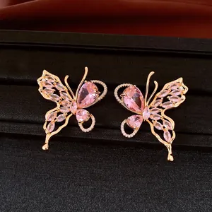 Pink crystal butterfly stud earrings with 18K gold plating detailed luxury jewelry view