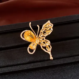 Close-up detail of 18K gold plated butterfly earring featuring vibrant yellow zircon stones
