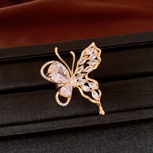 Detailed macro view of an elegant 18K gold plated butterfly earring with sparkling zircons
