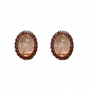 Eleganti orecchini a perno ovali di lusso vintage con cristalli rosa e stile palazzo oro