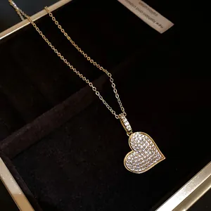 Detailed macro view of heart-shaped pendant necklace with sparkling cubic zirconia inlay