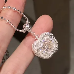 Macro detail shot of a Korean-style heart apple zircon pendant with a silver bead chain jewelry